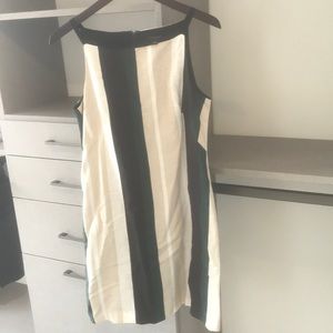 Green black white and cream colored striped dress